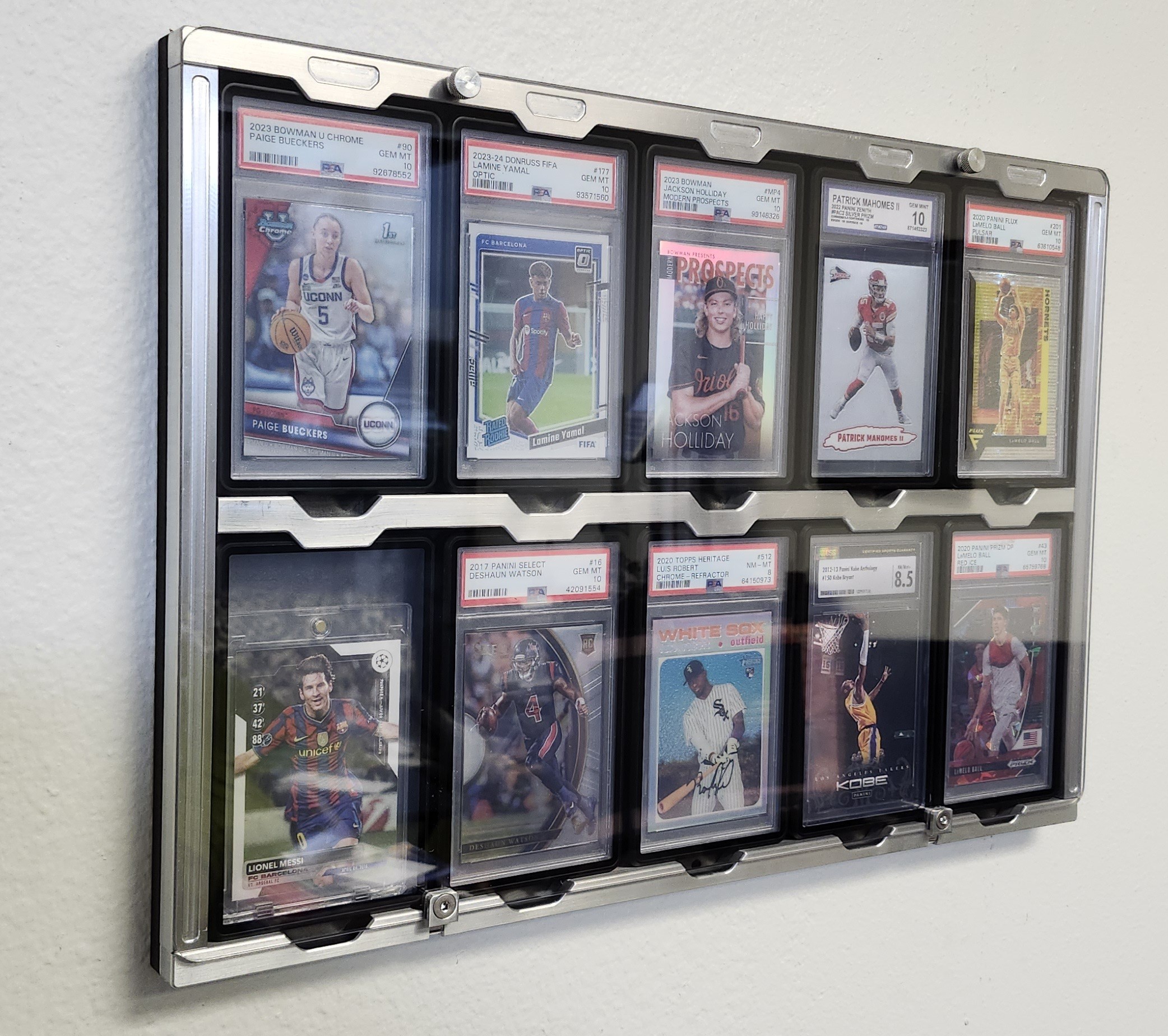 Base aluminum Protected Display wall-mounted with 10 PSA graded cards including Bueckers, Yamal, Holliday, Mahomes, and Messi